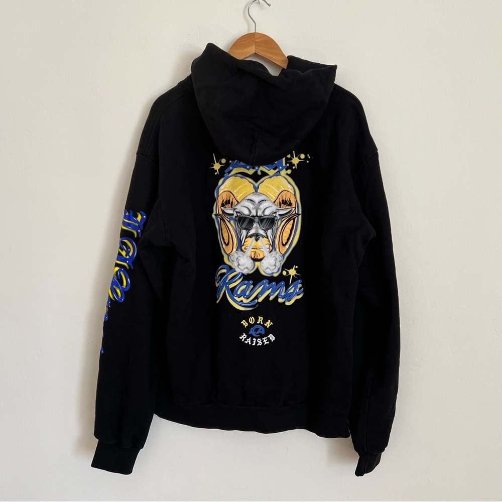LA Rams Born x Raised Black Airbrushed Rampage Pullover Hoodie - Picture 8 of 9
